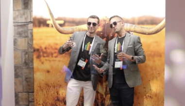 Two men posing at a conference