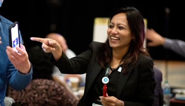 Team members interacting at a conference