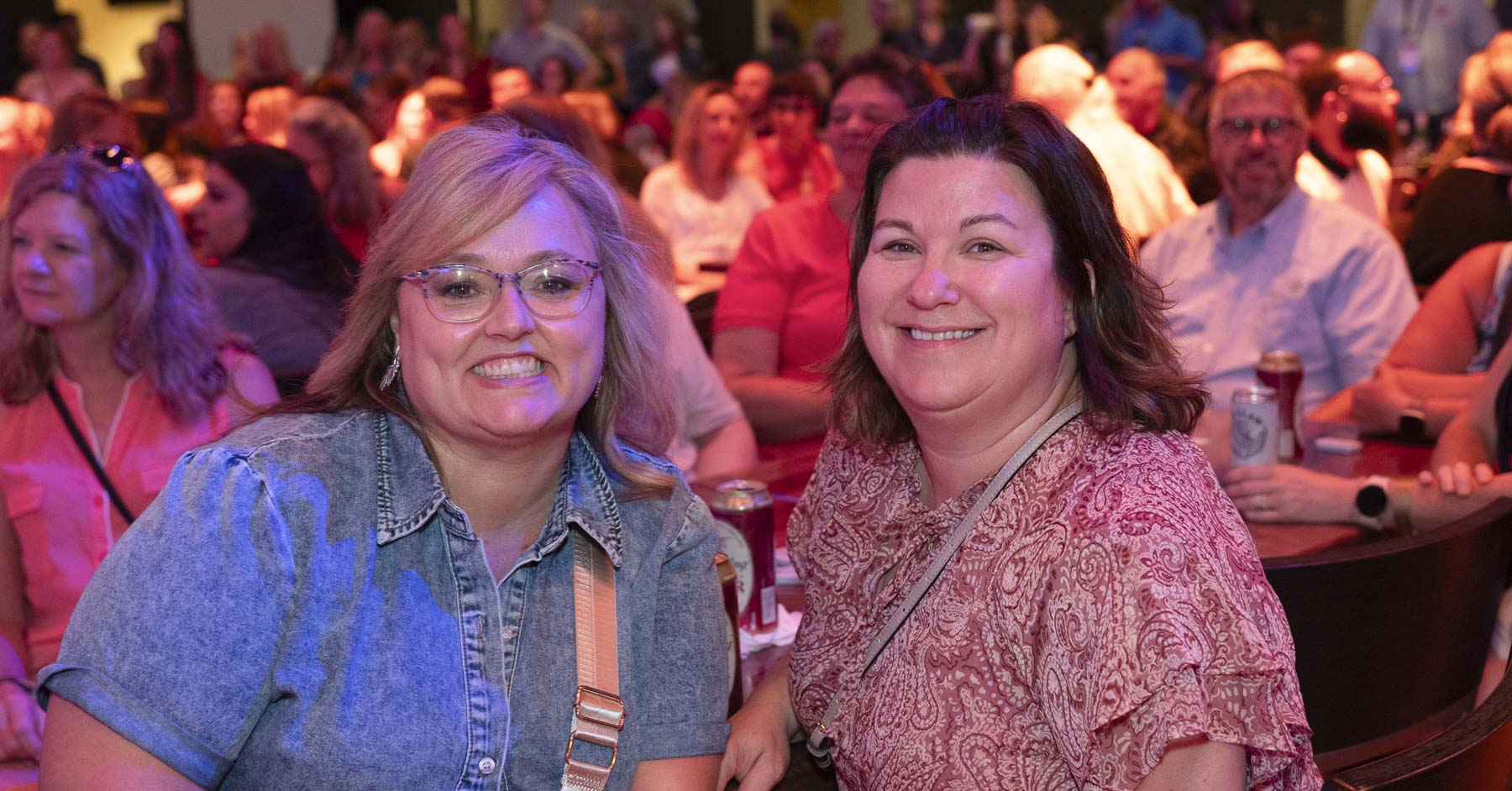 Two attendees smiling for a picture